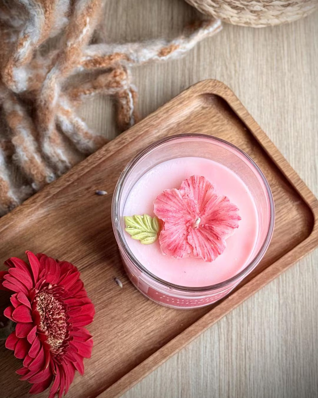 Hawaiian Hibiscus tropical flower candle in coconut soy wax with a moulded pink wax hibiscus
