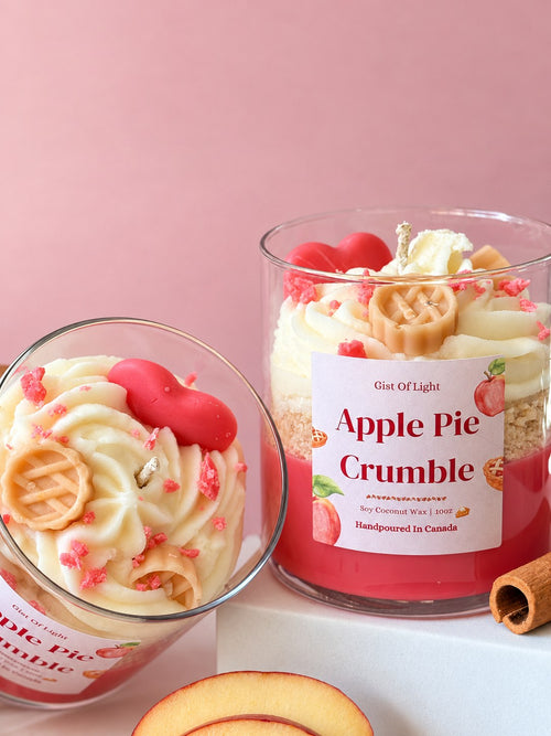 Apple Pie Crumble candle tipped to show the whipped wax top, wax lattice pie, red wax heart and pink crumble