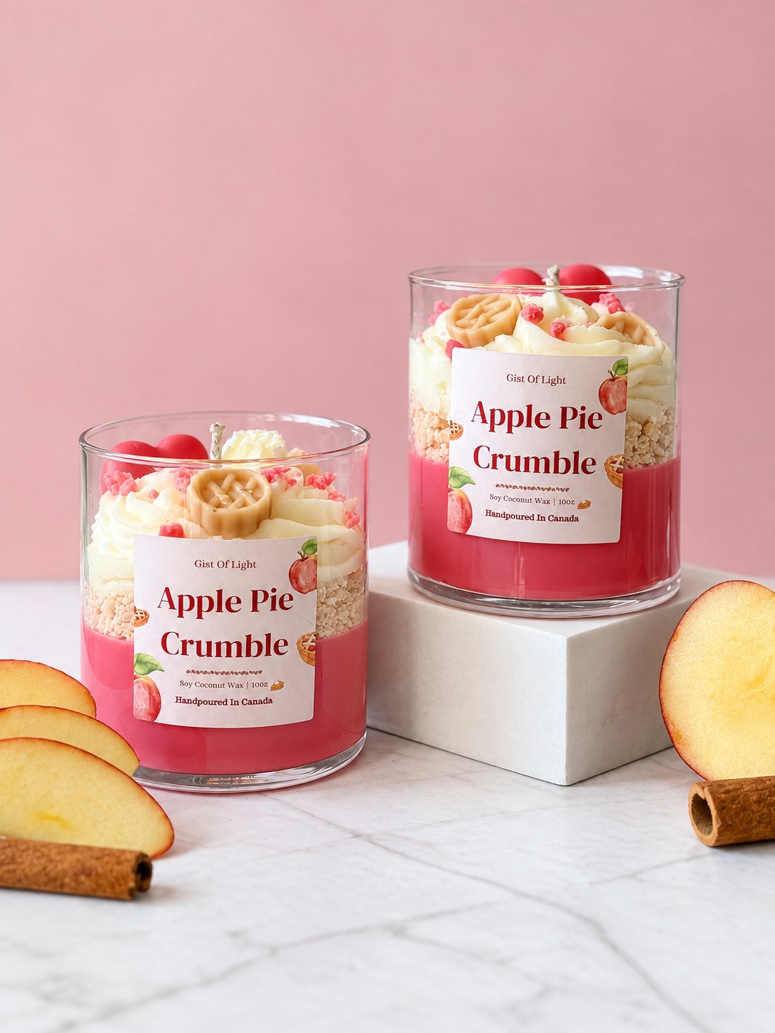 Two Apple Pie Crumble bakery scented candles with apple slices and cinnamon sticks