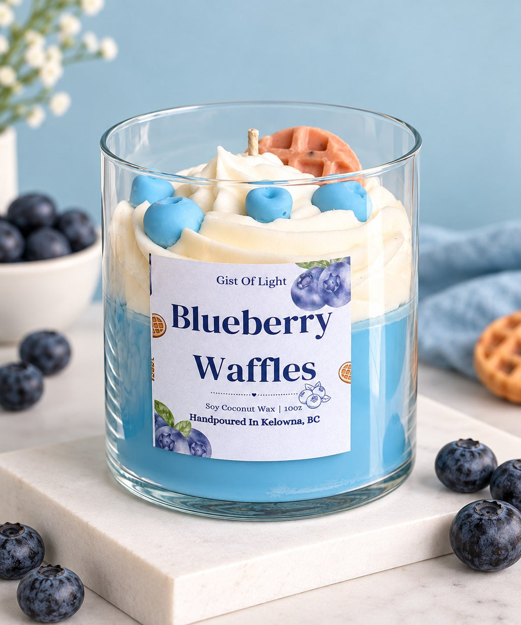 Blueberry Waffles dessert candle on a marble slab with fresh blueberries and a waffle