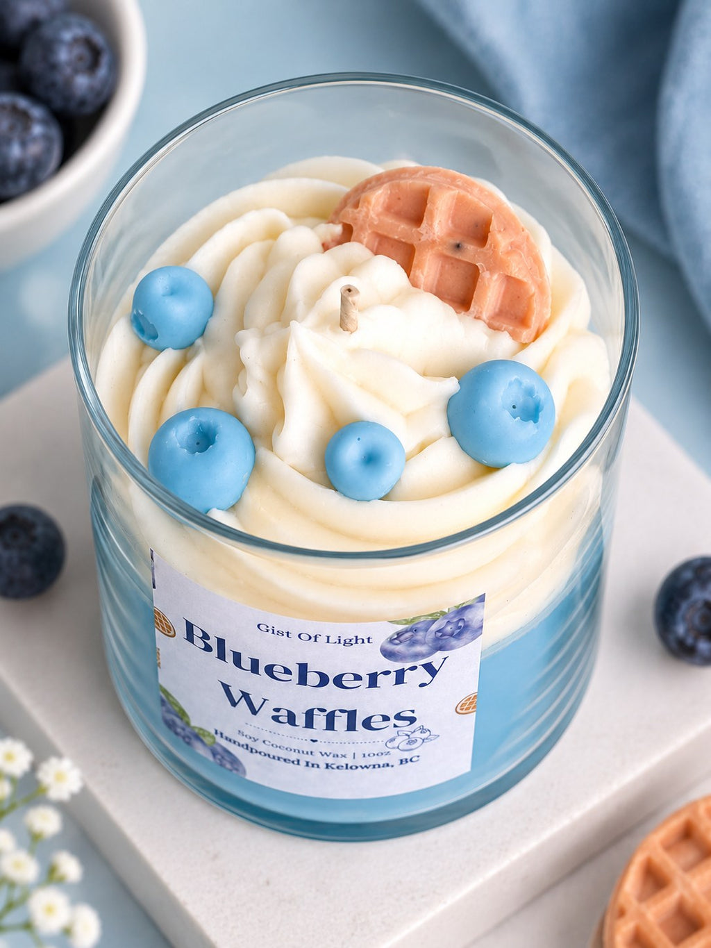 Close up of the Blueberry Waffles candle top with whipped wax swirl, wax blueberries and a waffle slice