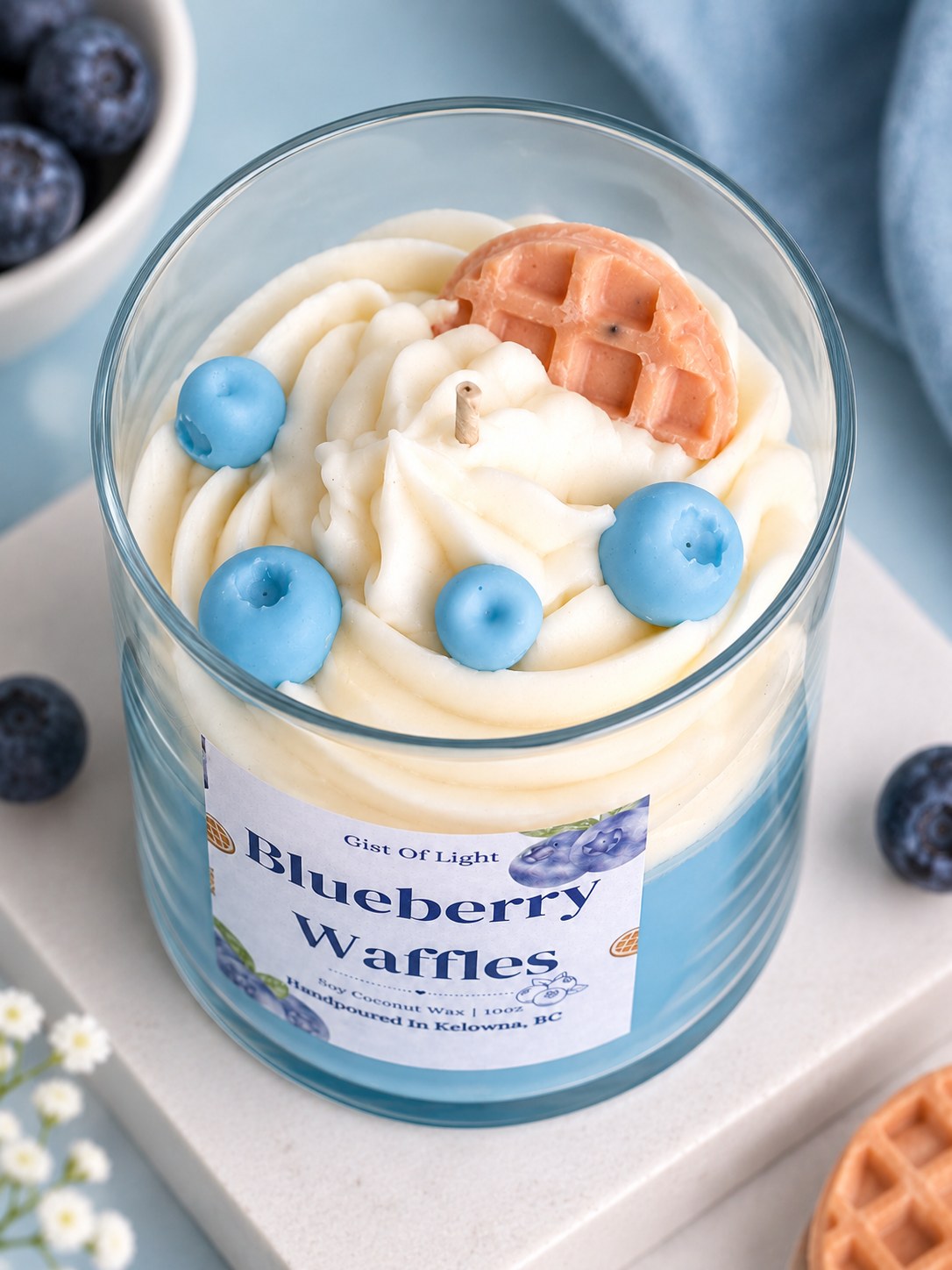 Close up of the Blueberry Waffles candle top with whipped wax swirl, wax blueberries and a waffle slice