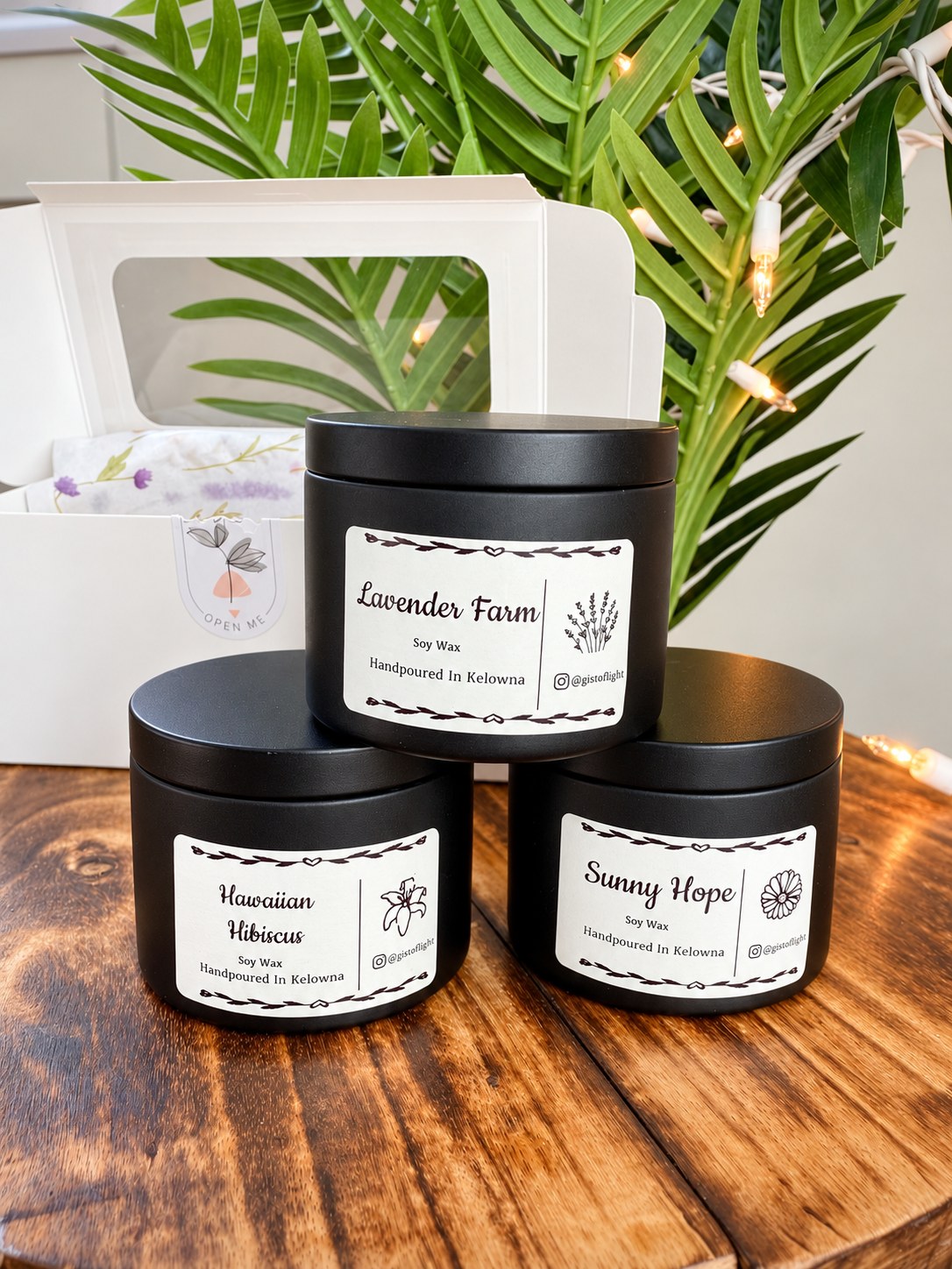 Floral Trio gift box with three black tin candles: Lavender Farm, Hawaiian Hibiscus and Sunny Hope