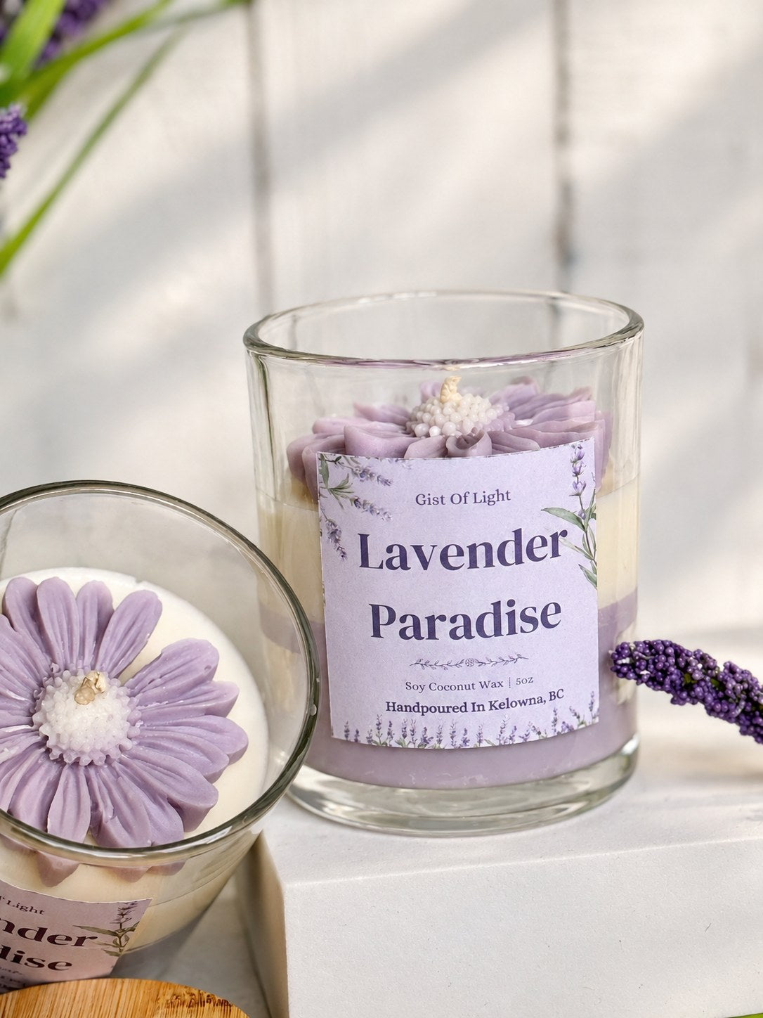 Lavender Paradise candle open to show the moulded purple wax flower and cotton wick