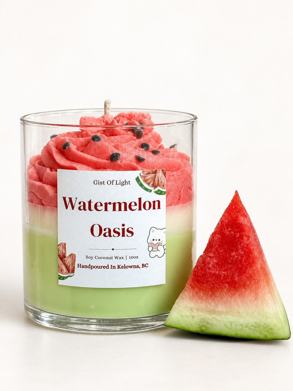 Watermelon Oasis hand poured candle showing the green wax base and pink whipped top