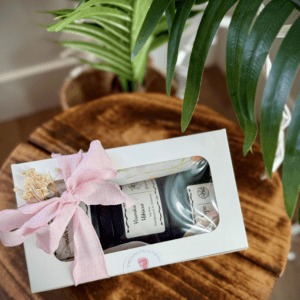 Elegant 3.5 oz tin candle gift set with a pink ribbon, perfect for cozy home decor or special occasi.