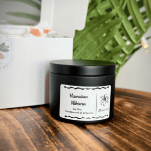 Hawaiian Hibiscus scented soy candle in a black tin, handcrafted in Kelowna. Perfect for relaxing an.